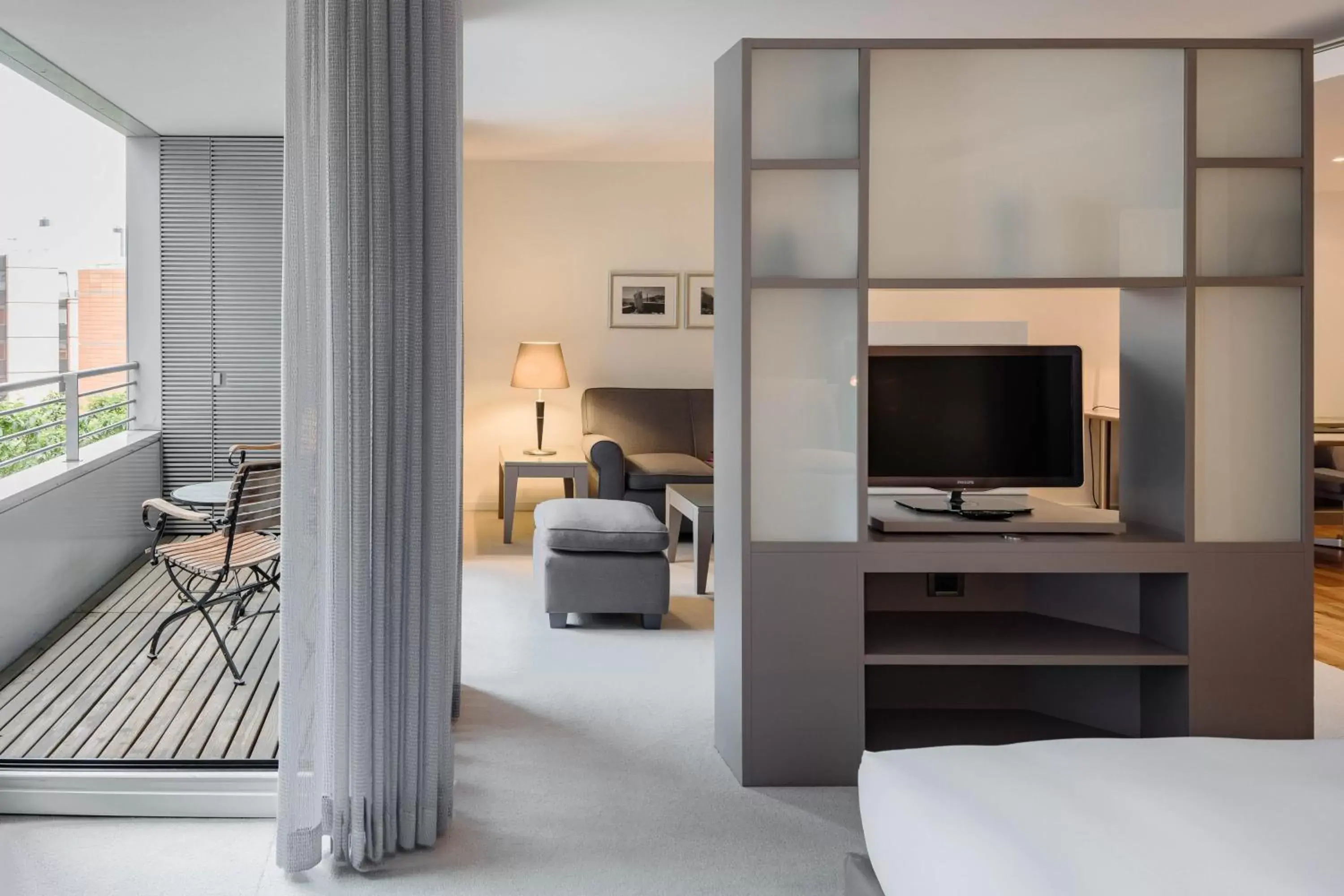 Living room, Bed in The Mandala Berlin, a Member of Design Hotels Living room, Bed in The Mandala Berlin, a Member of Design Hotels