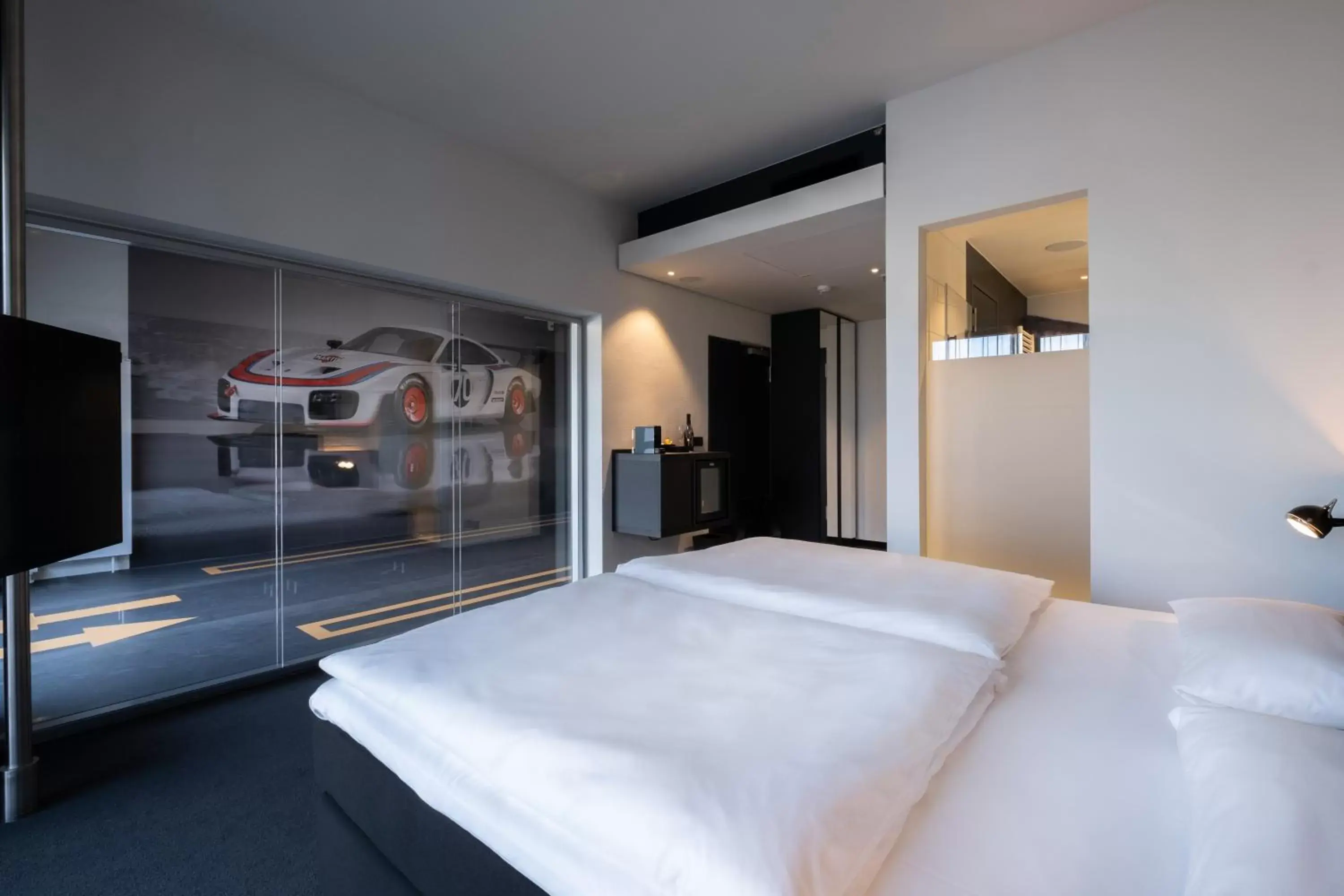 Photo of the whole room, Bed in V8 Hotel Köln at MOTORWORLD Photo of the whole room, Bed in V8 Hotel Köln at MOTORWORLD
