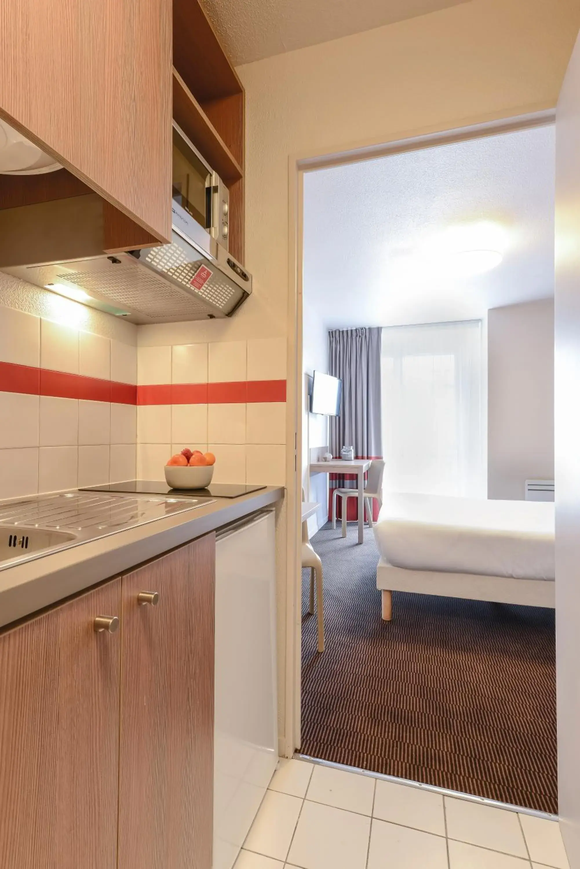 Photo of the whole room, Bed in Appart'City Classic Paris La Villette Photo of the whole room, Bed in Appart'City Classic Paris La Villette