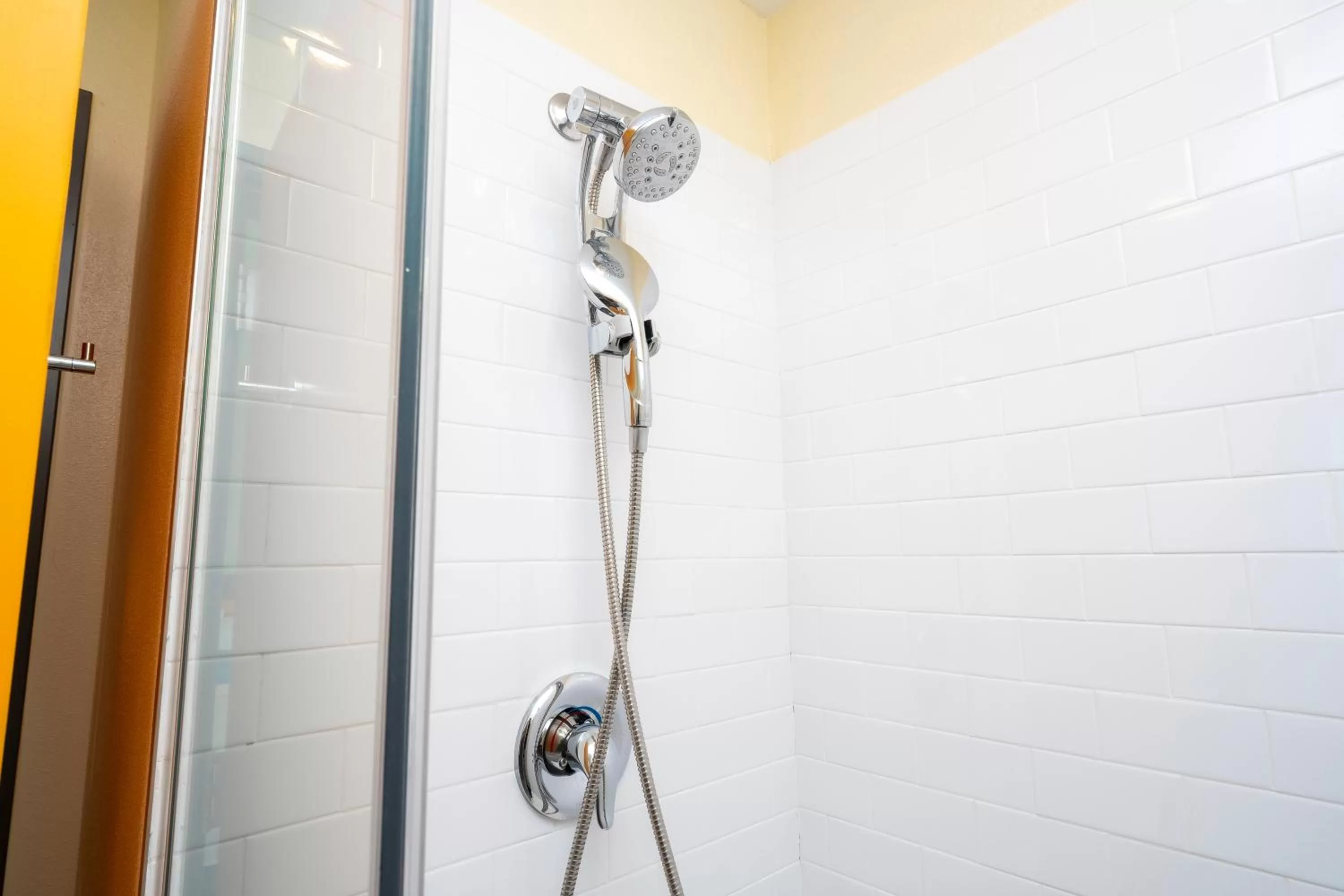 Shower in SPOT X Hotel Orlando Intl Dr by The Red Collection