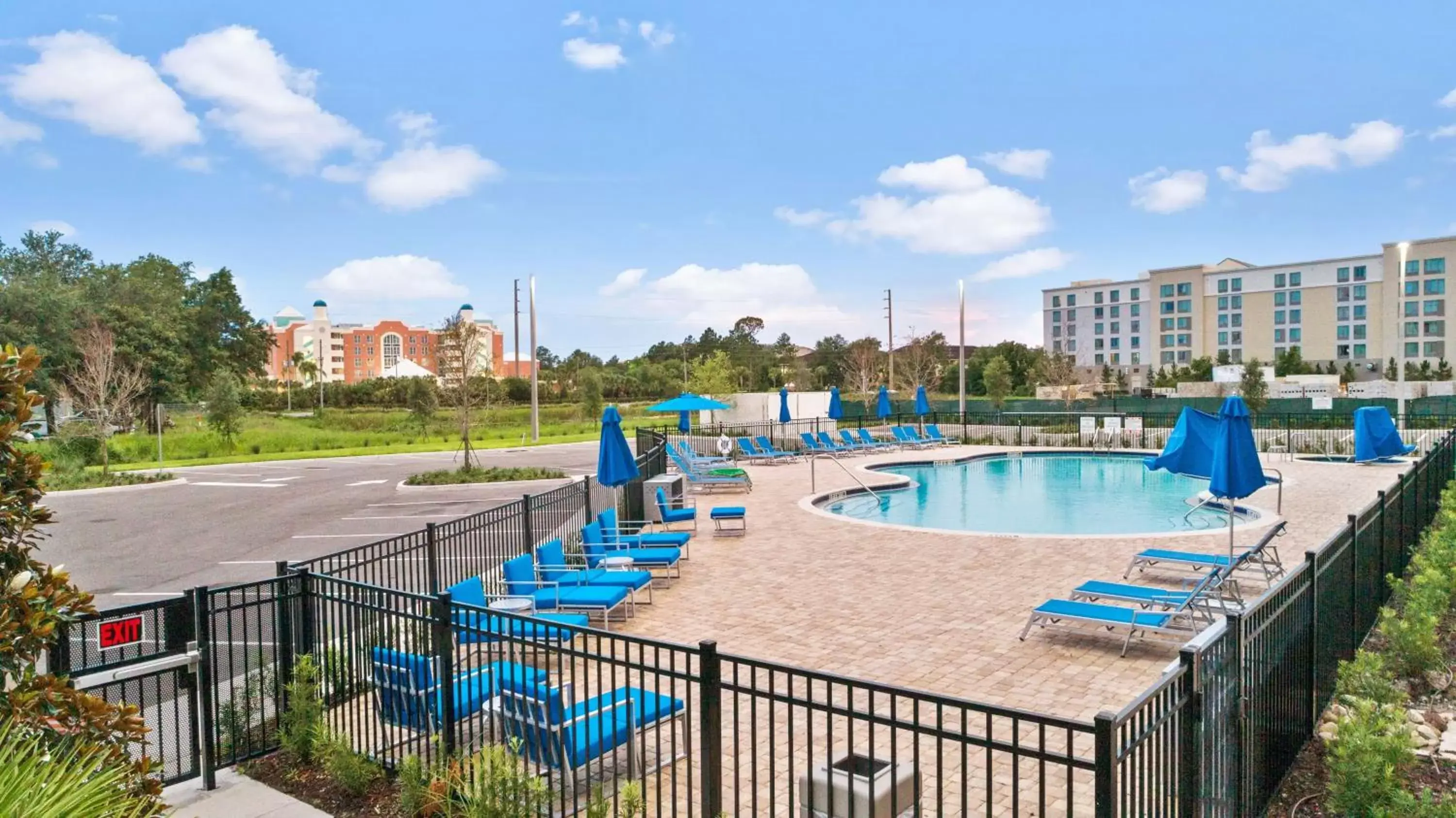 Swimming pool in Holiday Inn Express & Suites Orlando- Lake Buena Vista by IHG Swimming pool in Holiday Inn Express & Suites Orlando- Lake Buena Vista by IHG