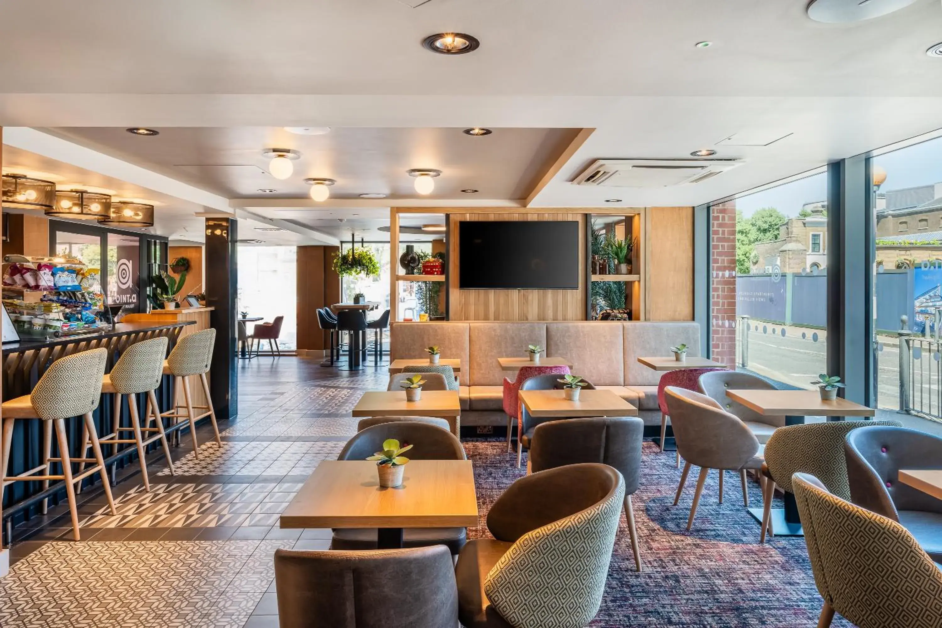 Communal lounge/ TV room in Point A Hotel London Canary Wharf Communal lounge/ TV room in Point A Hotel London Canary Wharf