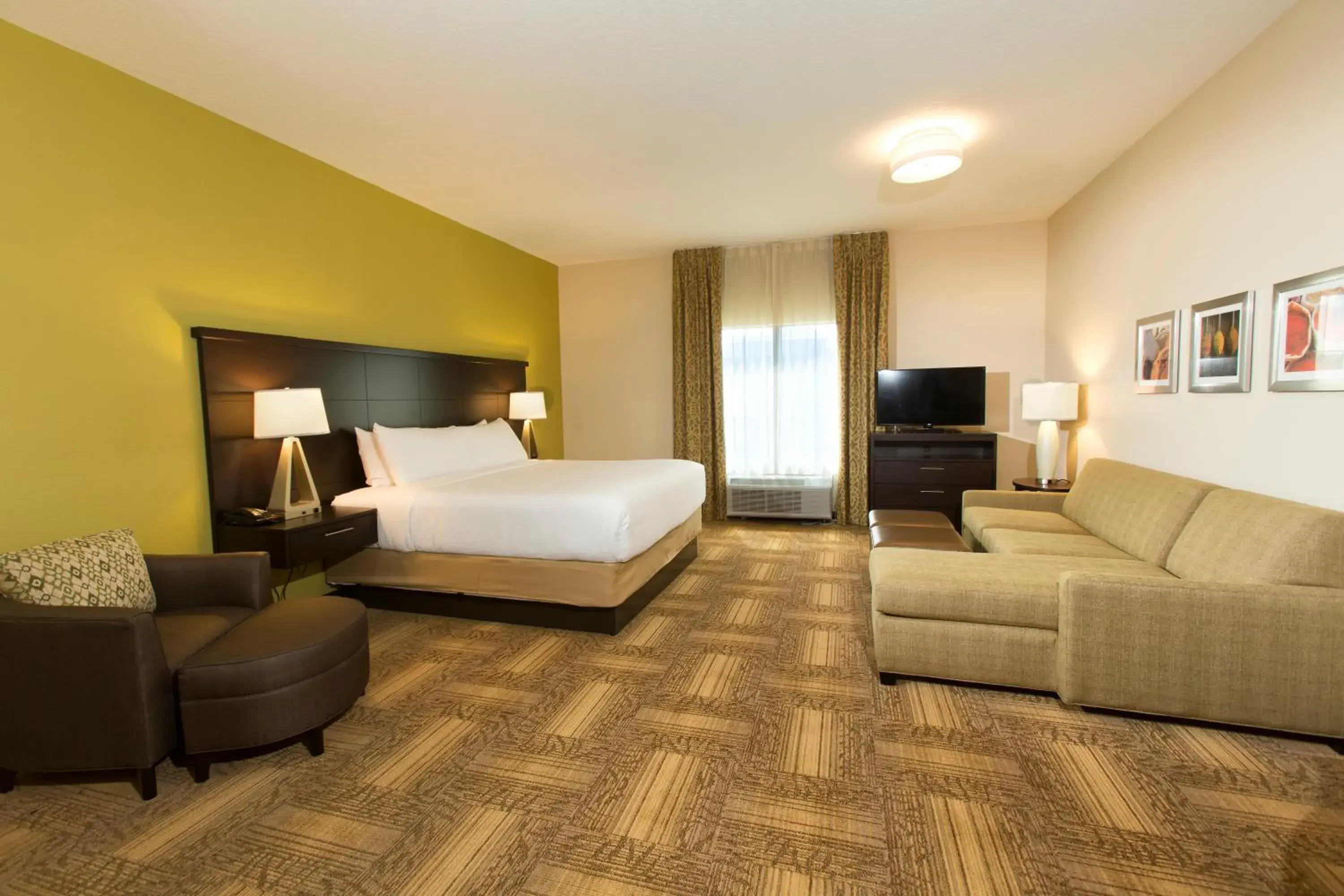 Living room, Bed in Staybridge Suites Orlando at SeaWorld by IHG - Free Breakfast & Shuttle to SeaWorld Parks Living room, Bed in Staybridge Suites Orlando at SeaWorld by IHG - Free Breakfast & Shuttle to SeaWorld Parks